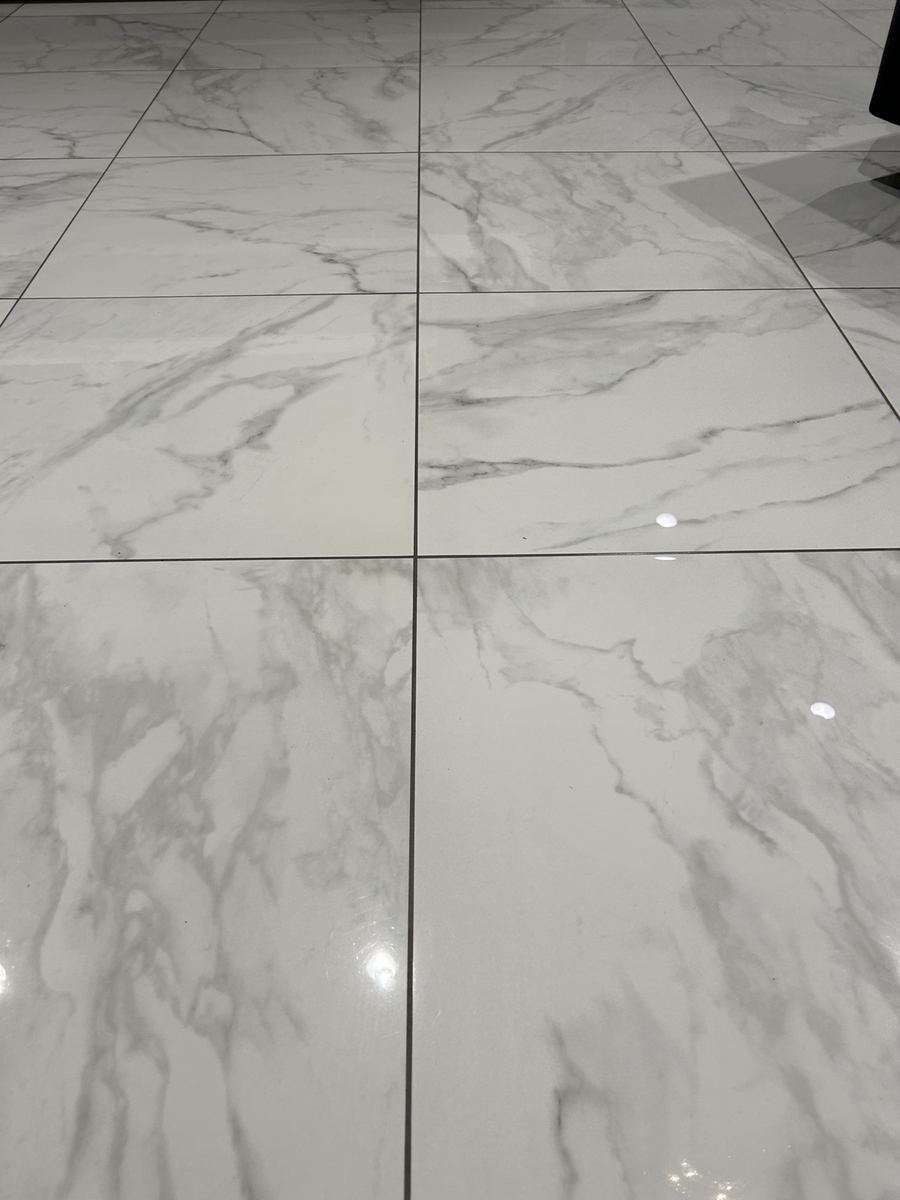 Close up of glossy white tile floor