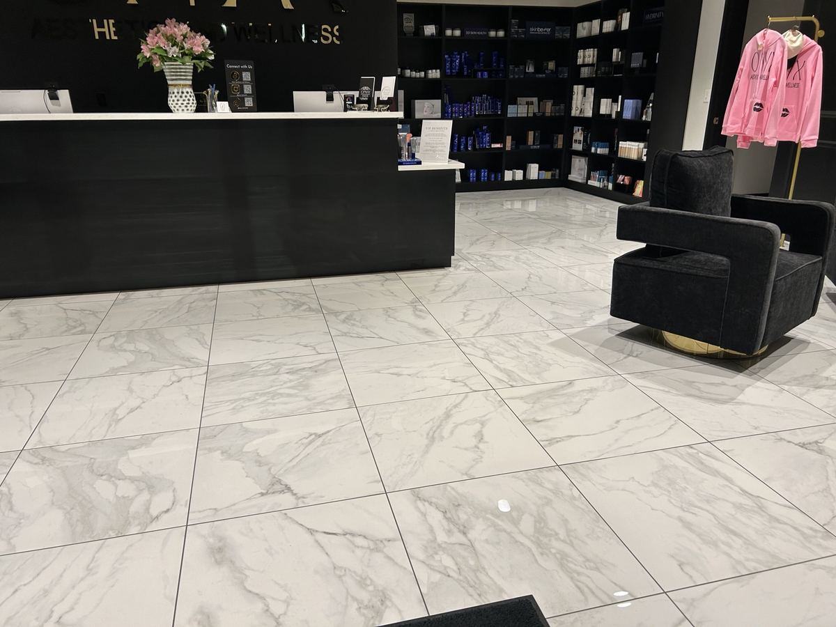 Bright salon lobby with clean tile floor
